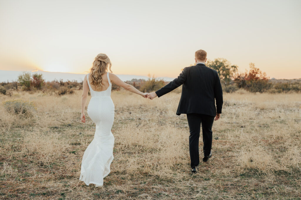 sunset photography bride and groom wedding day holding hands