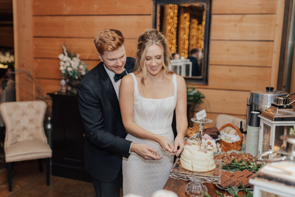 bride and groom cake cutting wedding reception