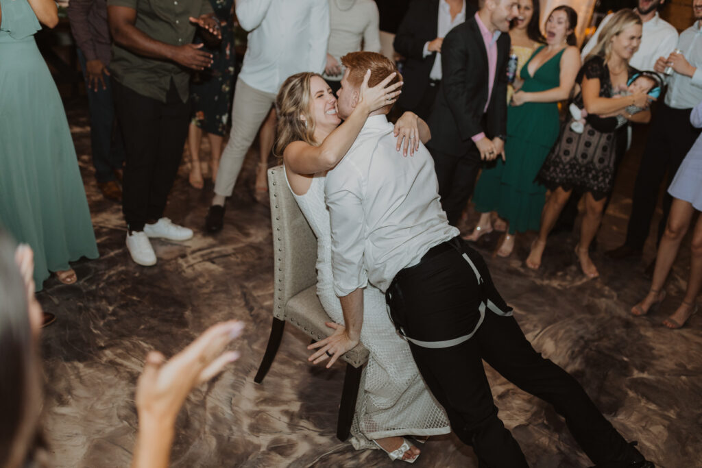 bride and groom dancing garter toss
