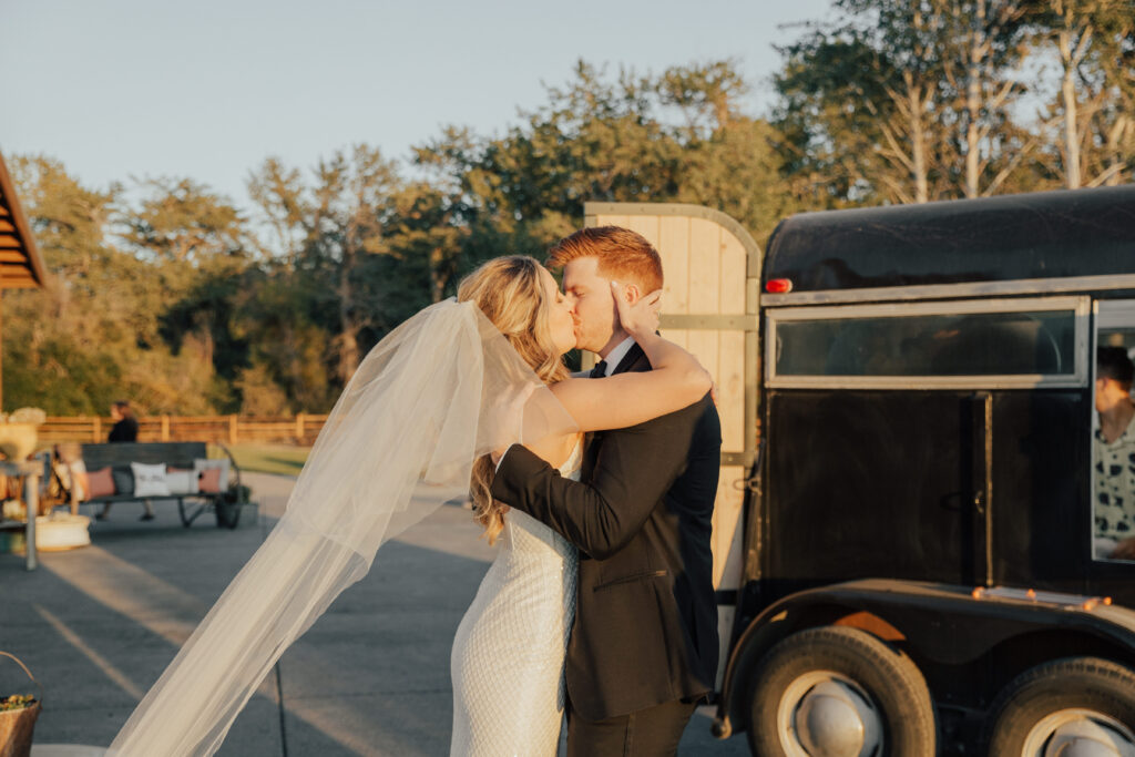 sunset photography bride and groom wedding day kiss